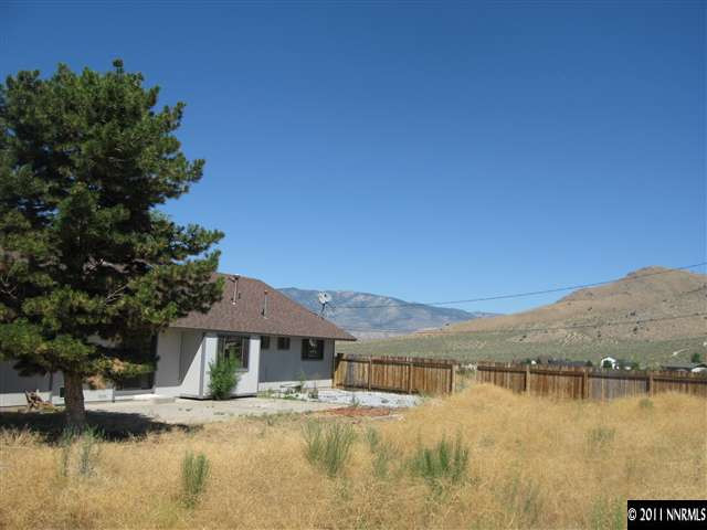 2849 Wade Street Minden, NV 89423 - Photo 8 of 13 a view of a lake with a house in background