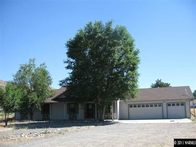 2849 Wade Street Minden, NV 89423 - Photo 9 of 13 a front view of a house with a garden