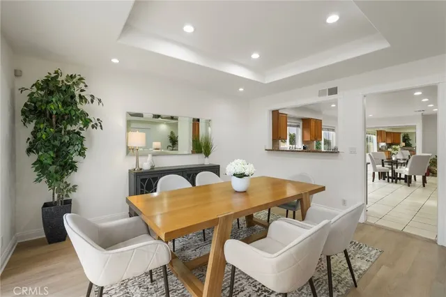 a kitchen with a sink refrigerator and cabinets