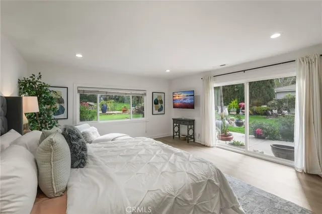 a bedroom with a bed and a couch