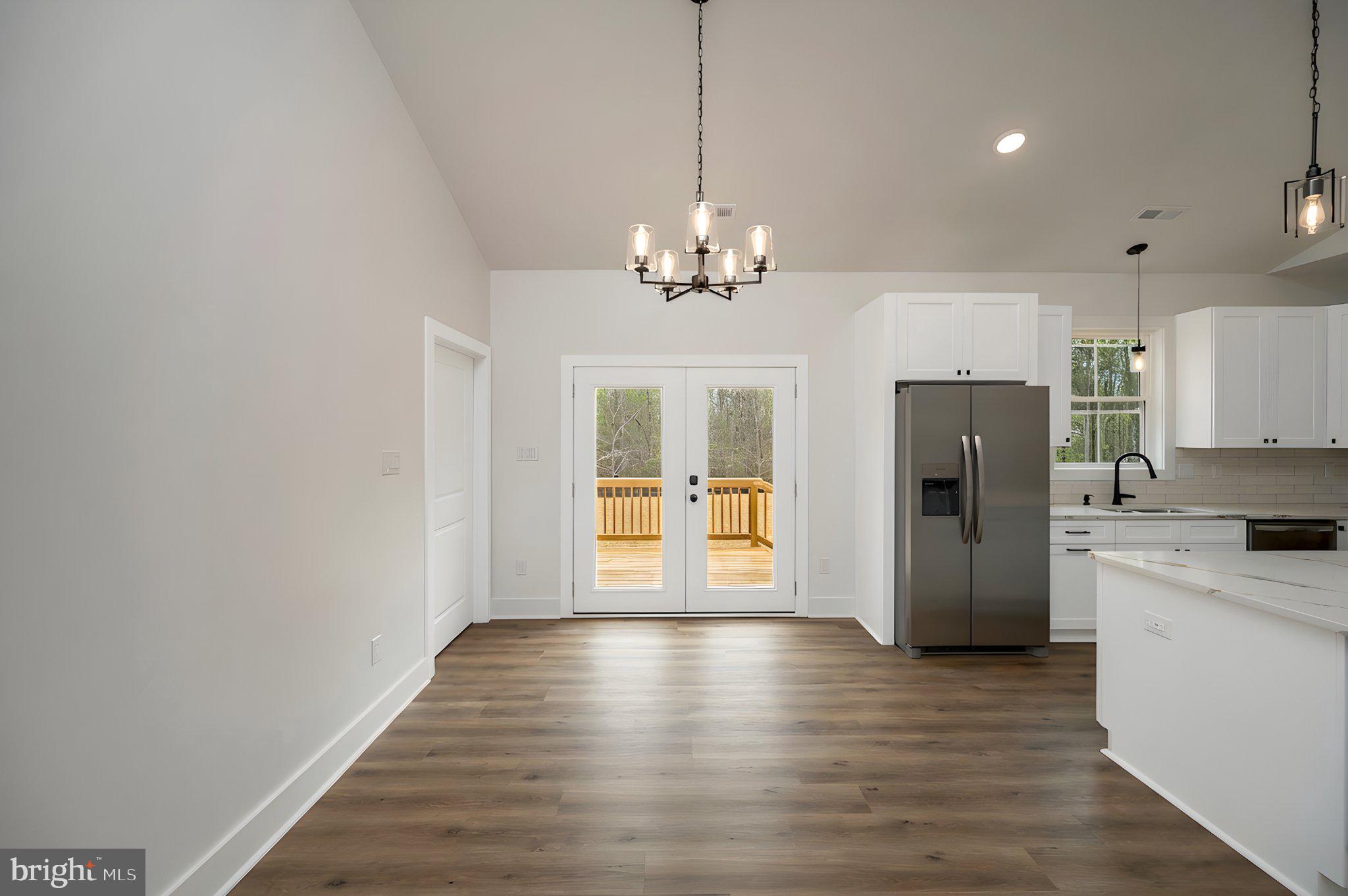 17342 Mallorys Ford Road Gordonsville, VA 22942 - Photo 19 of 38 a view of a refrigerator in kitchen and wooden floor