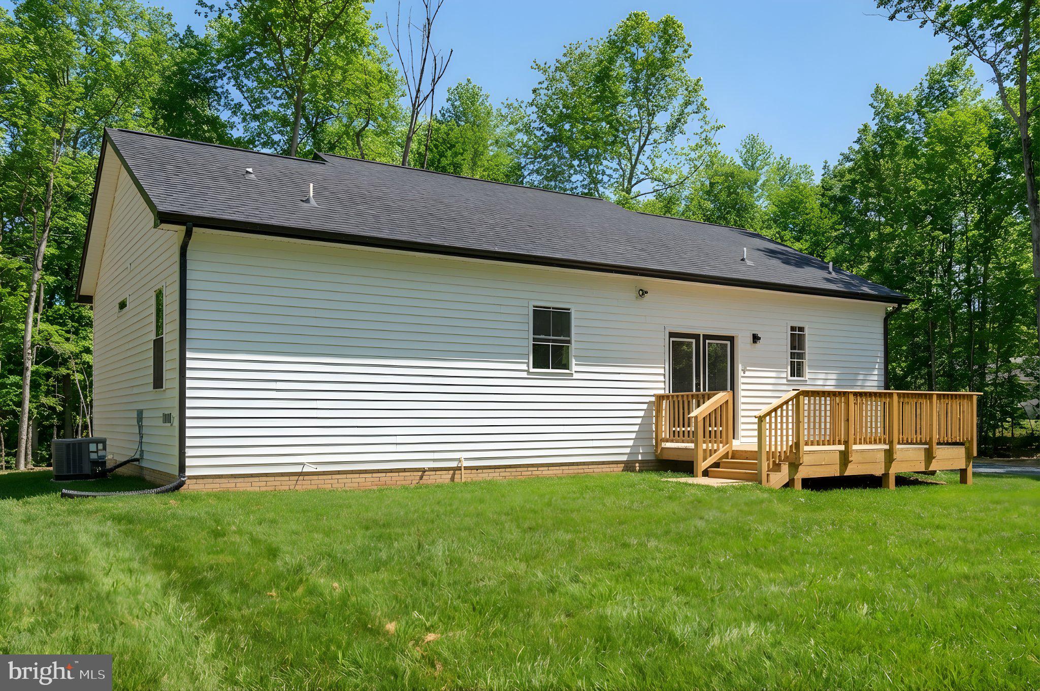 17342 Mallorys Ford Road Gordonsville, VA 22942 - Photo 3 of 38 a view of a back yard of the house