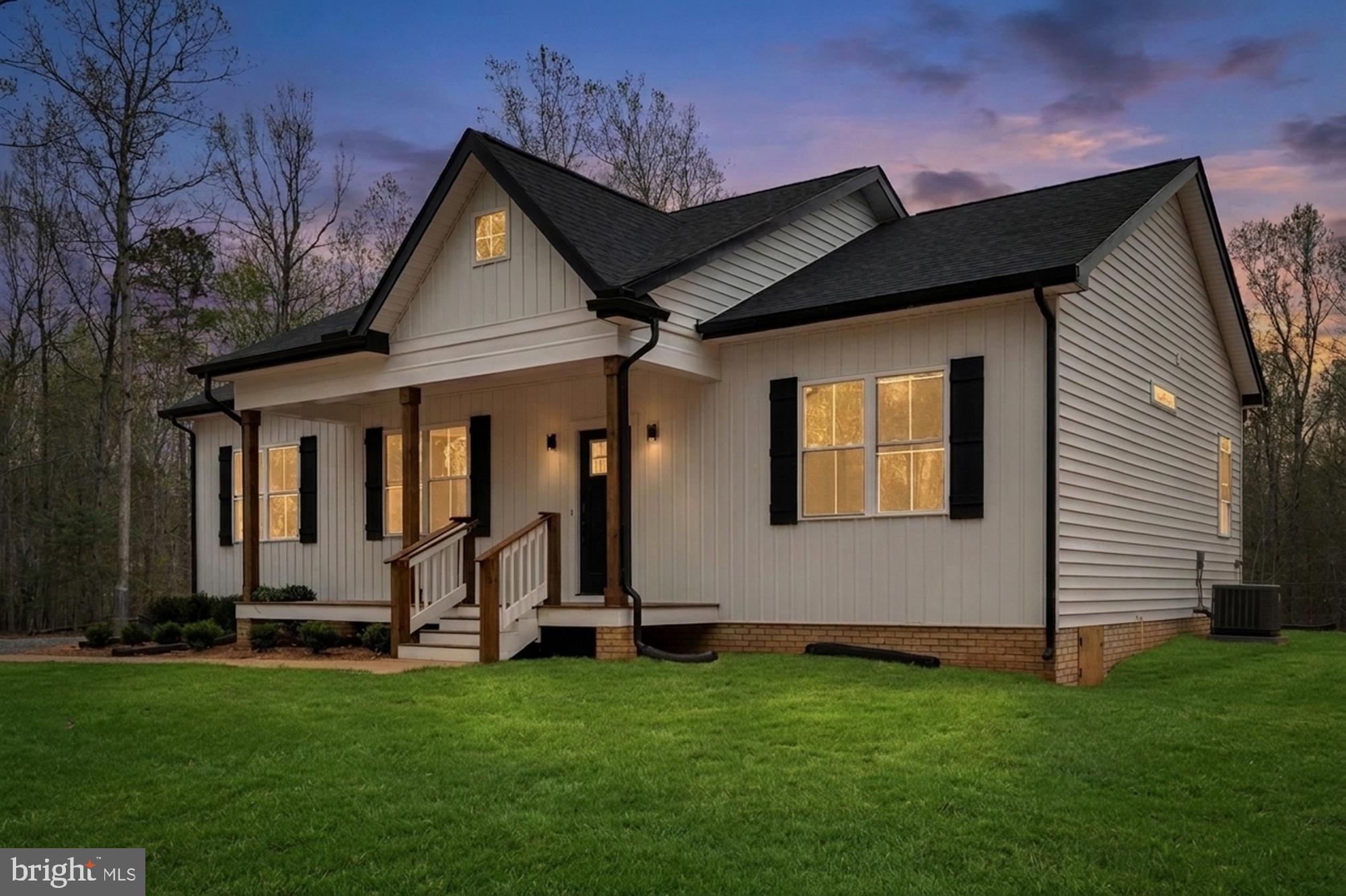 17342 Mallorys Ford Road Gordonsville, VA 22942 - Photo 5 of 38 a front view of a house with a yard