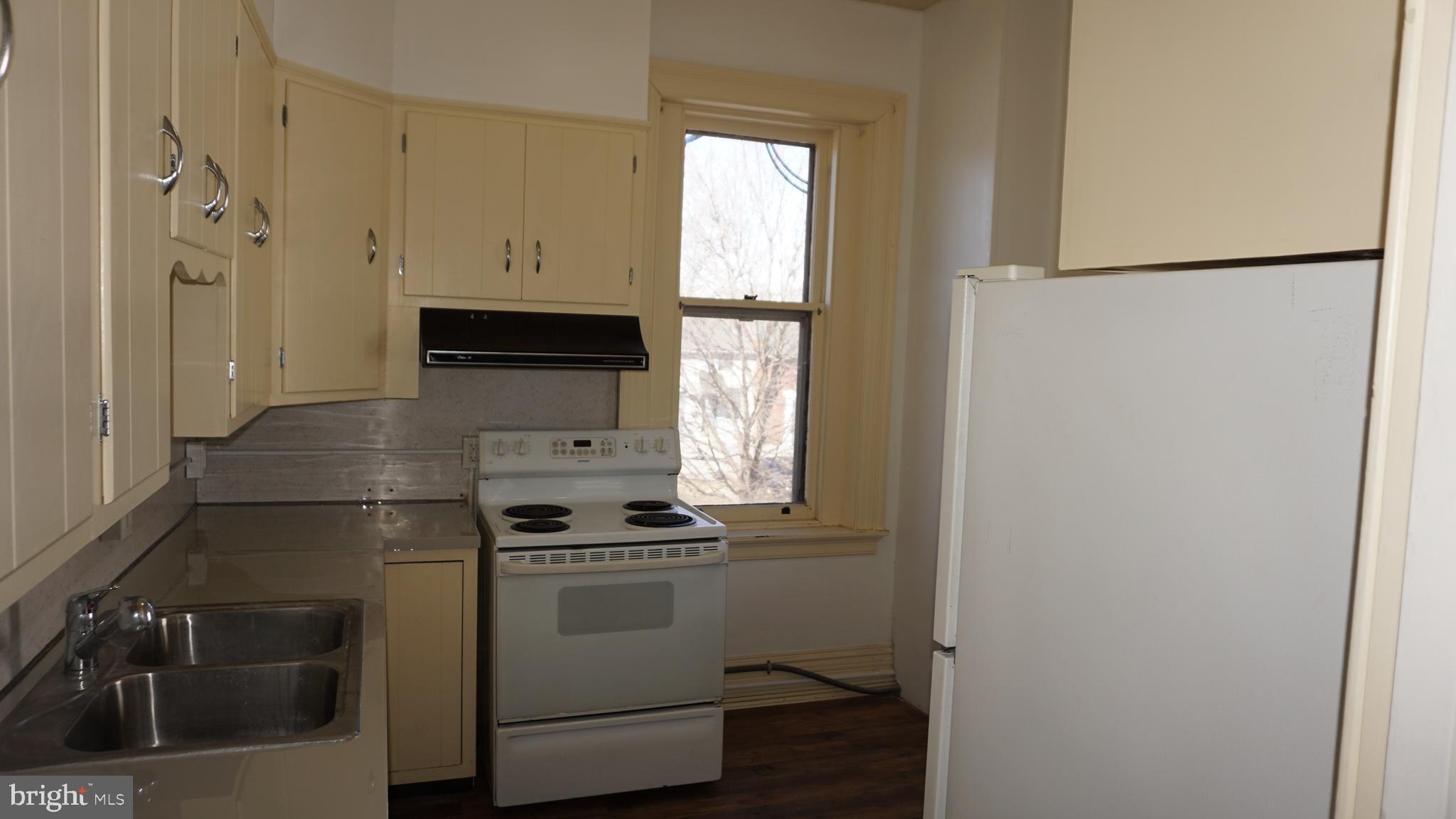 200 East Walnut Street, Unit 4 Hanover, PA 17331 - Photo 11 of 47 a kitchen with a refrigerator and a sink