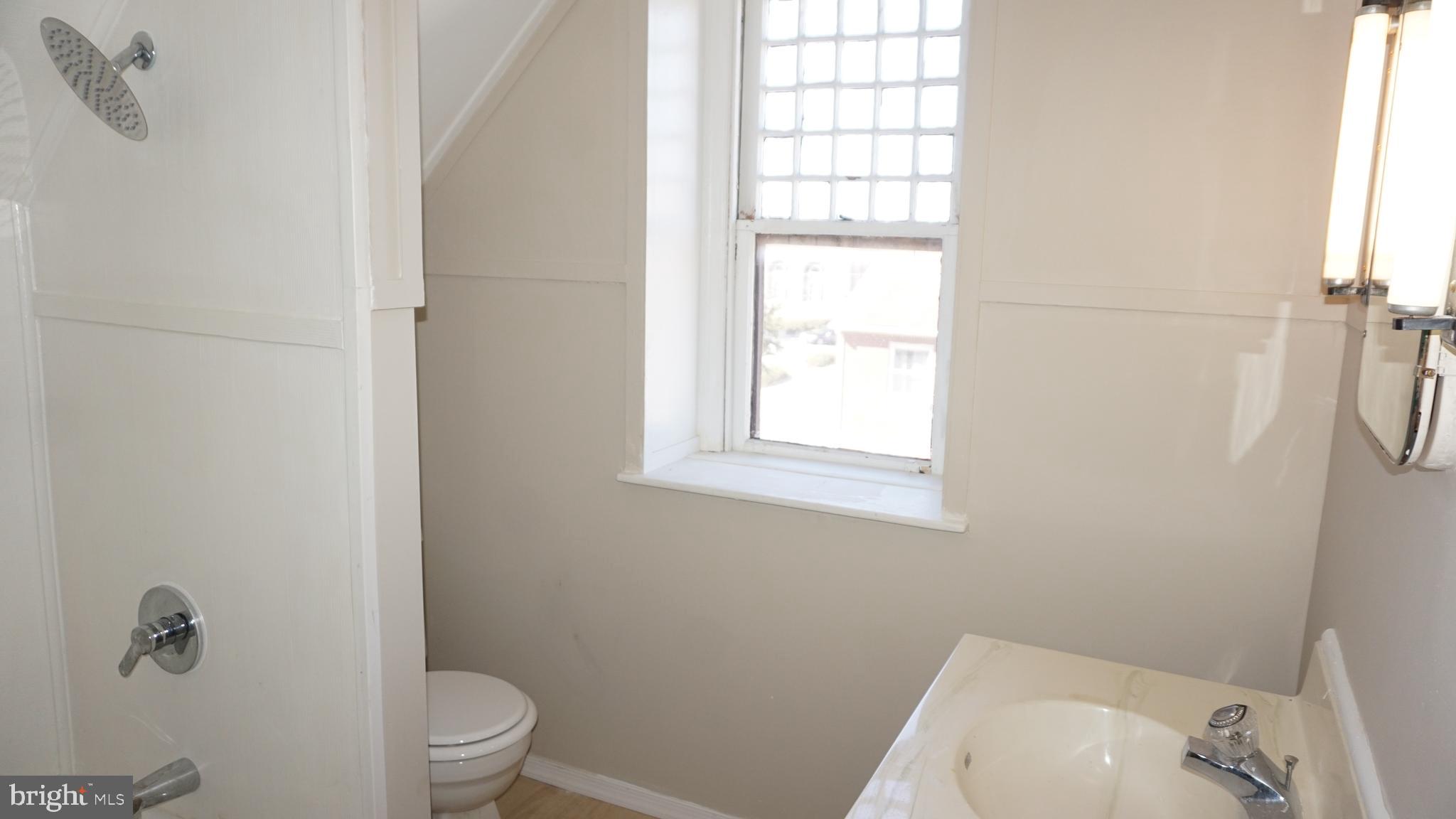 200 East Walnut Street, Unit 4 Hanover, PA 17331 - Photo 17 of 47 a white toilet sitting next to a window