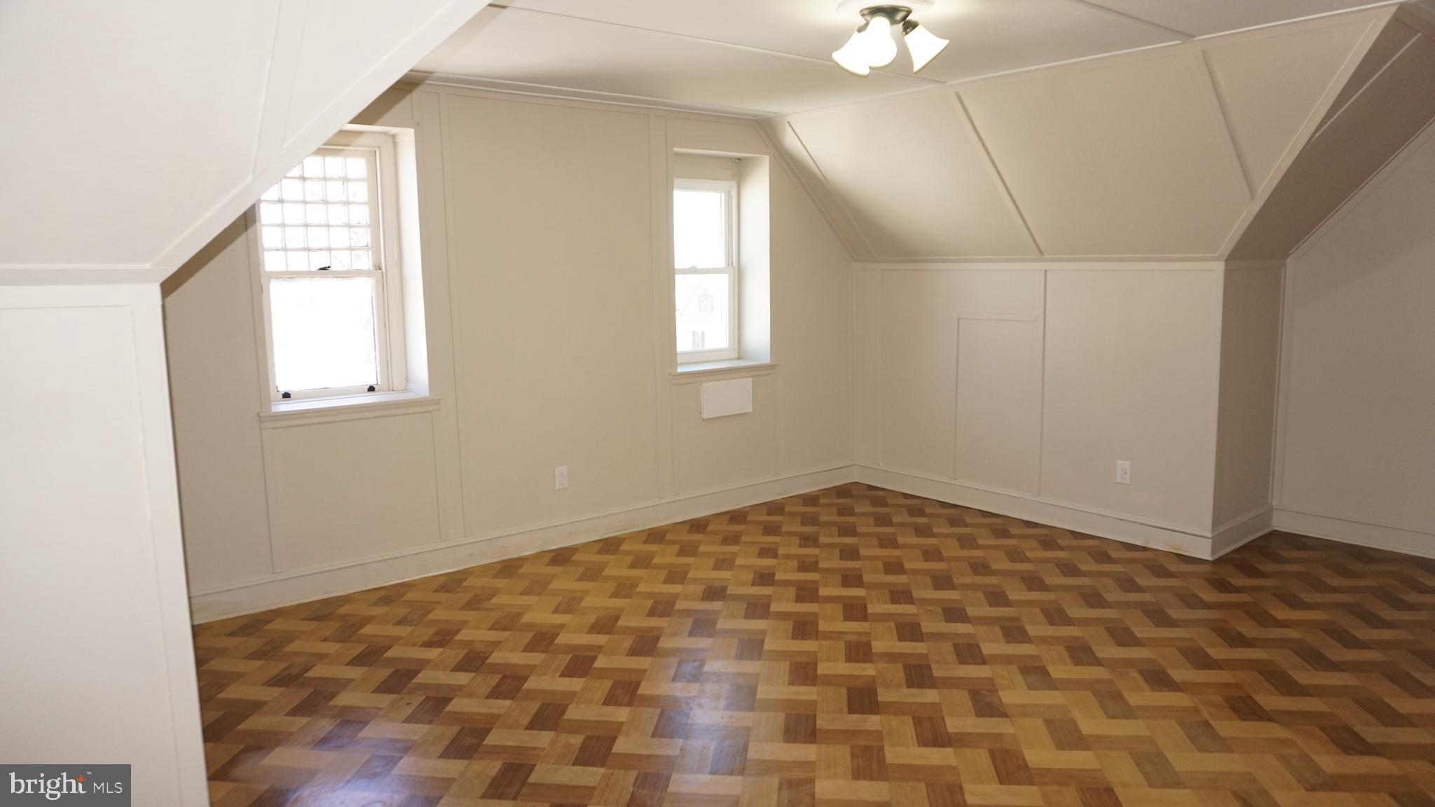 200 East Walnut Street, Unit 4 Hanover, PA 17331 - Photo 19 of 47 wooden floor in an empty room with a window