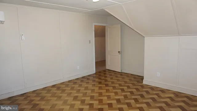 a view of walk in closet with clothes