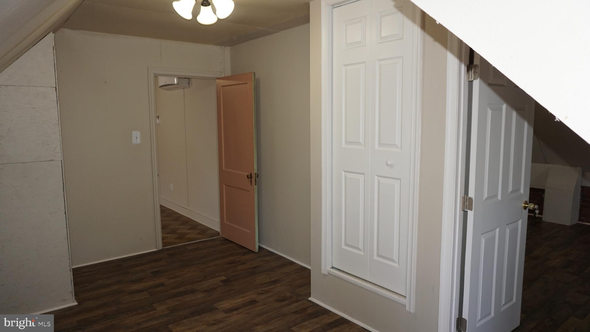 200 East Walnut Street, Unit 4 Hanover, PA 17331 - Photo 33 of 47 a view of a hallway with wooden floor and staircase