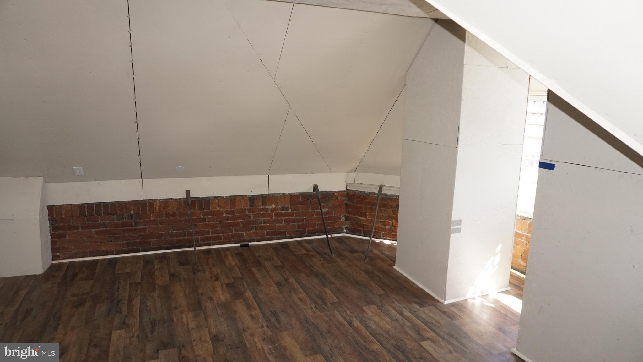 200 East Walnut Street, Unit 4 Hanover, PA 17331 - Photo 34 of 47 a view of a room with wooden floor