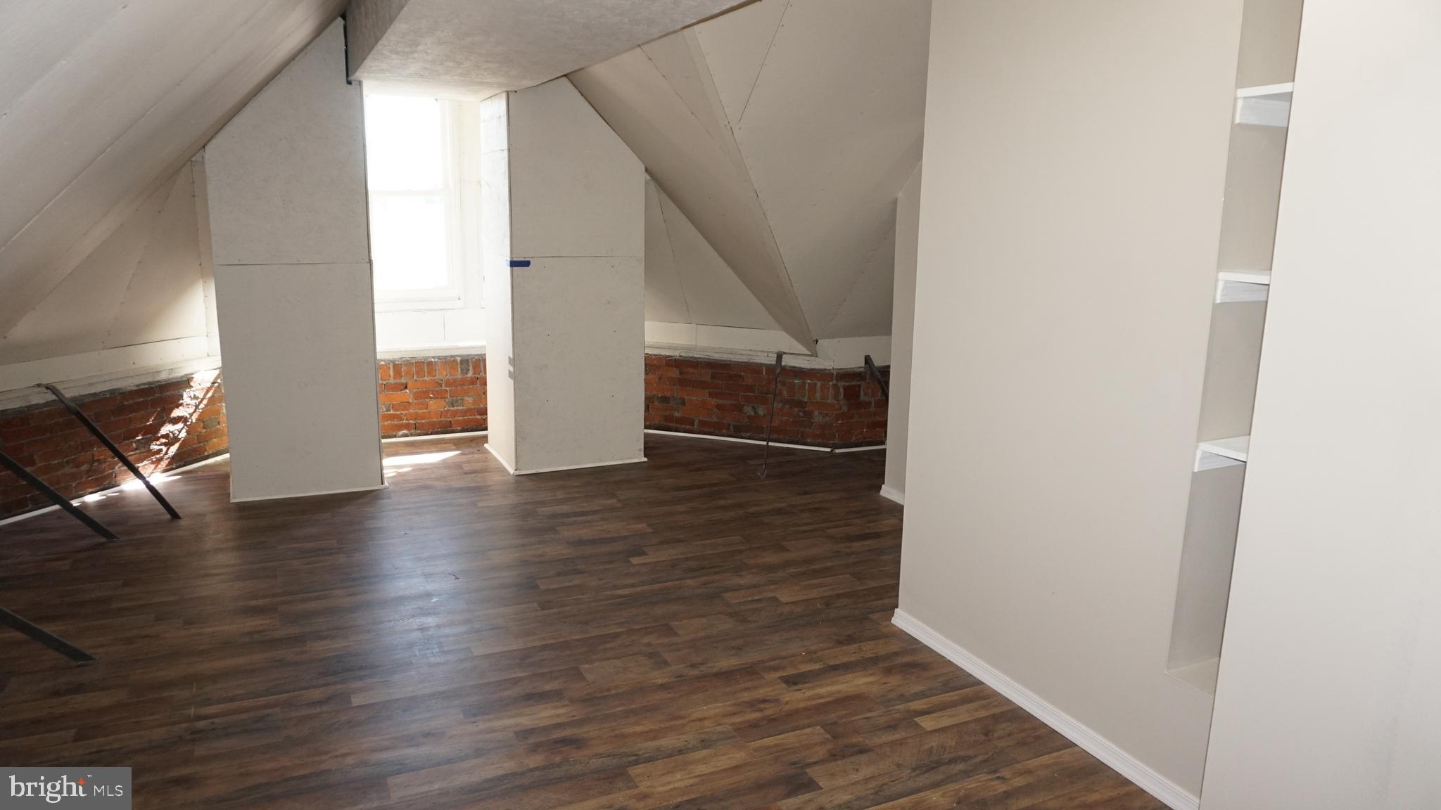 200 East Walnut Street, Unit 4 Hanover, PA 17331 - Photo 37 of 47 a view of a hallway view with wooden floor and staircase