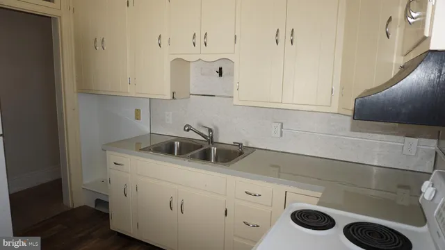a kitchen with a sink and cabinets