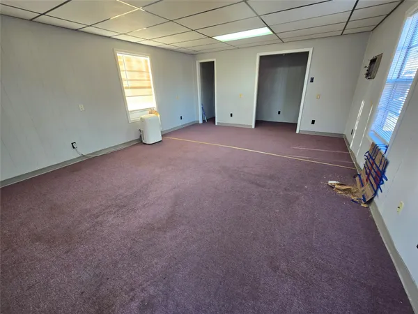 an empty room with windows