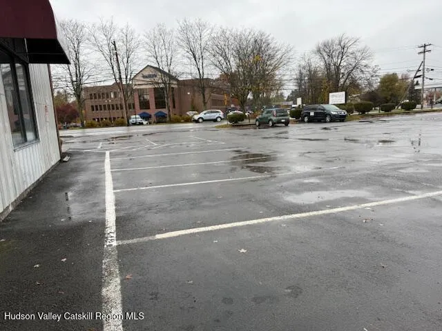 a view of a street with a building in the background
