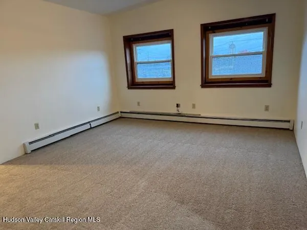 an empty room with windows