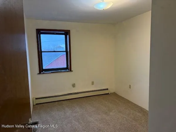 an empty room with a bench