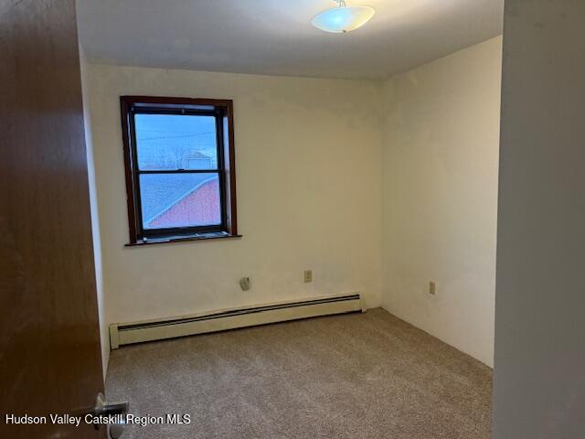 1112 Morton Boulevard, Unit 1 Kingston, NY 12401 - Photo 10 of 12 an empty room with a bench