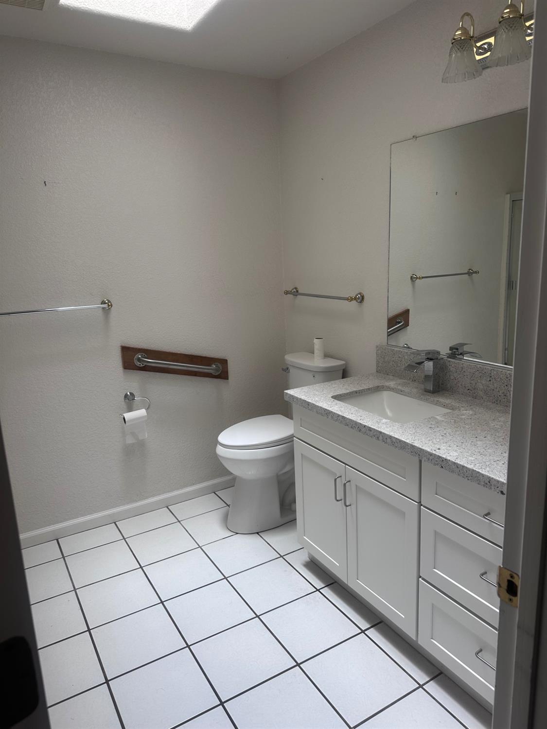 7124 Ospital Road Valley Springs, CA 95252 - Photo 23 of 37 a bathroom with a sink and a toilet