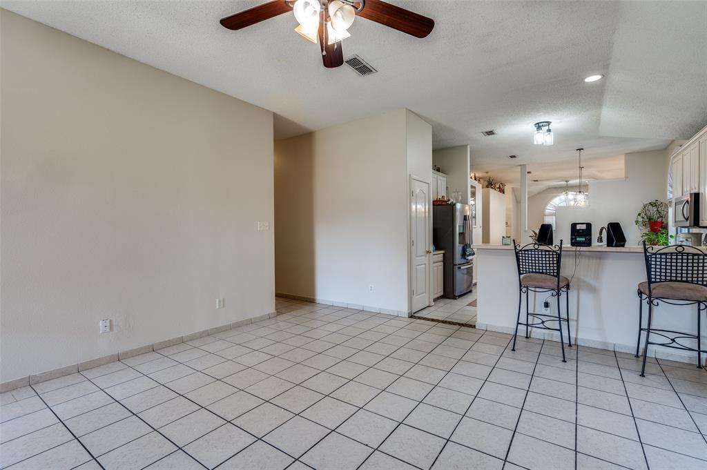 9120 River Trails Boulevard Fort Worth, TX 76118 - Photo 14 of 25 a view of a livingroom with furniture and a chandelier fan