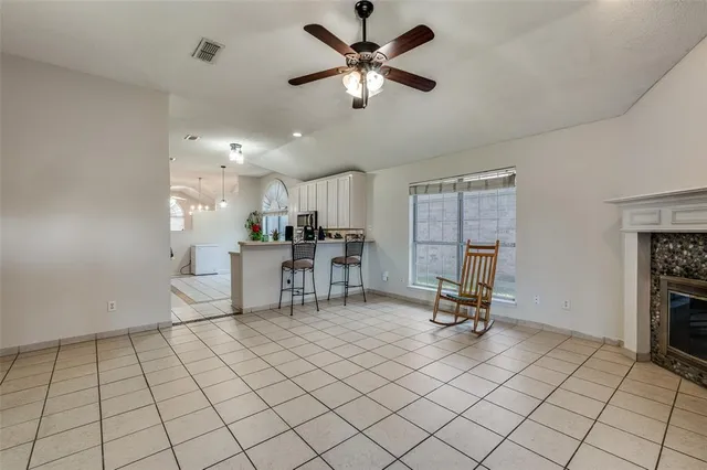 a view of a room with gym equipment and a large window