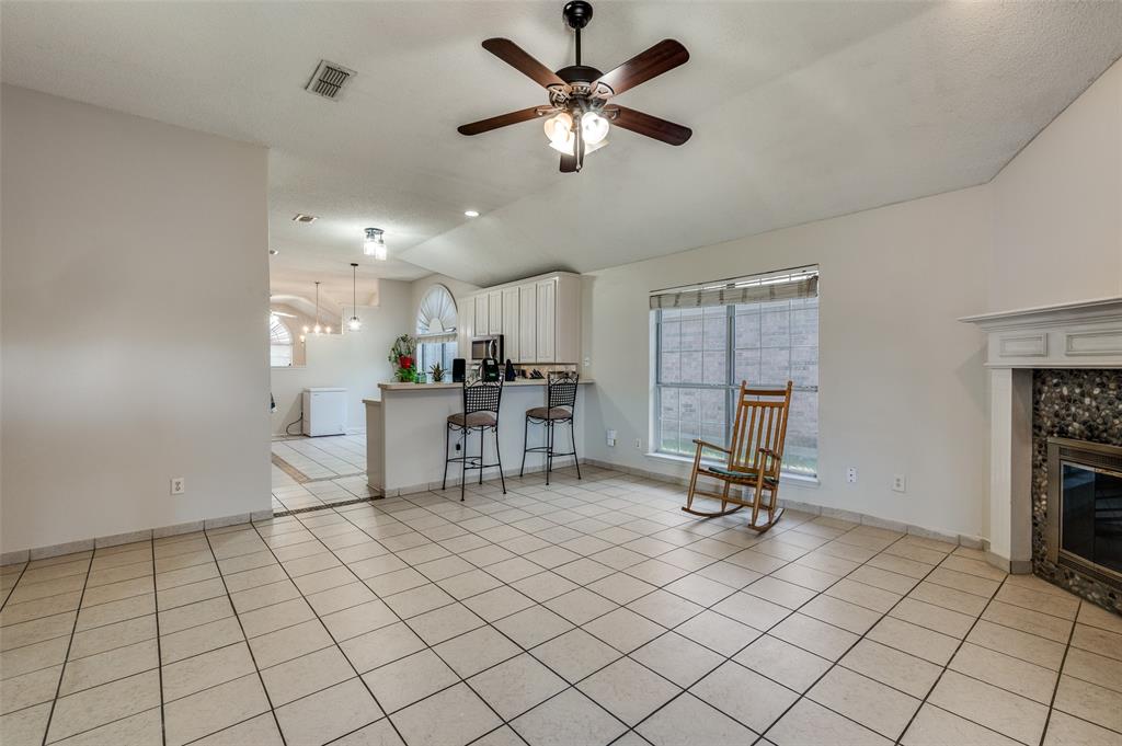 9120 River Trails Boulevard Fort Worth, TX 76118 - Photo 10 of 25 a view of a room with gym equipment and a large window
