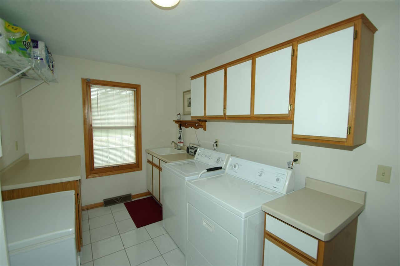 7254 Sentinel Road Rockford, IL 61107 - Photo 15 of 25 a view of utility room and bedroom