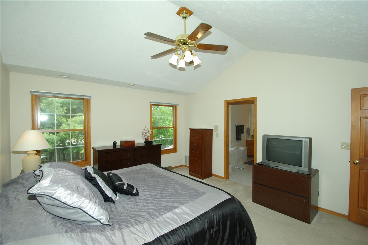 7254 Sentinel Road Rockford, IL 61107 - Photo 17 of 25 a bedroom with a bed and a couch