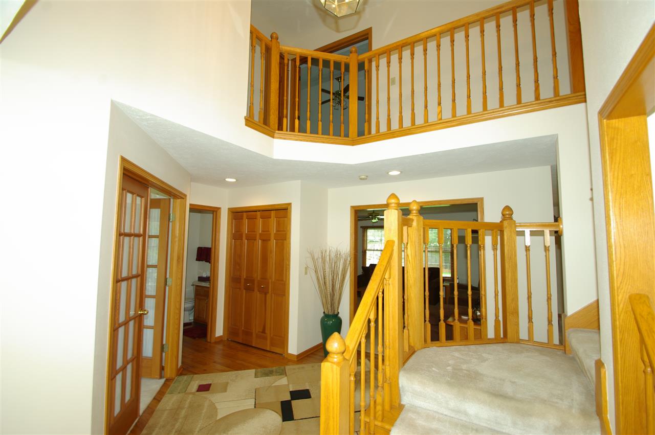 7254 Sentinel Road Rockford, IL 61107 - Photo 2 of 25 a view of a hallway with wooden door