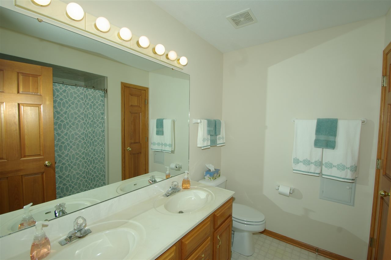 7254 Sentinel Road Rockford, IL 61107 - Photo 21 of 25 a bathroom with a sink a toilet and shower