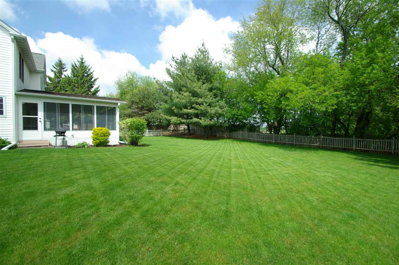 7254 Sentinel Road Rockford, IL 61107 - Photo 24 of 25 a view of a house with a backyard porch and sitting area