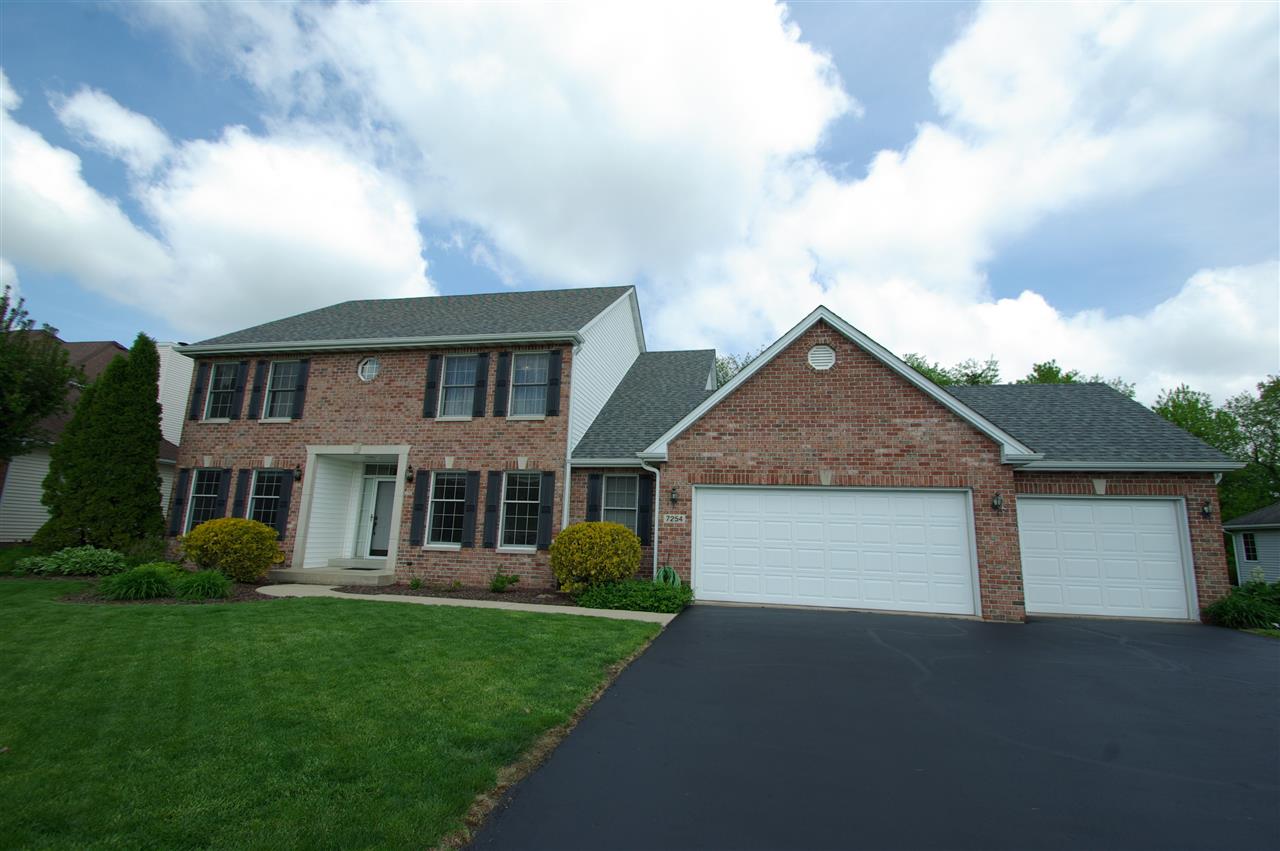 7254 Sentinel Road Rockford, IL 61107 - Photo 25 of 25 a front view of a house with a garden and yard