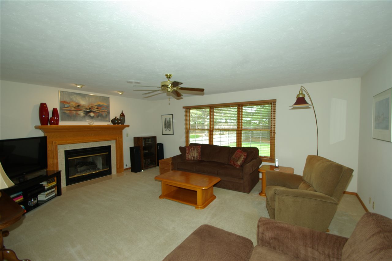 7254 Sentinel Road Rockford, IL 61107 - Photo 3 of 25 a living room with furniture and a fireplace