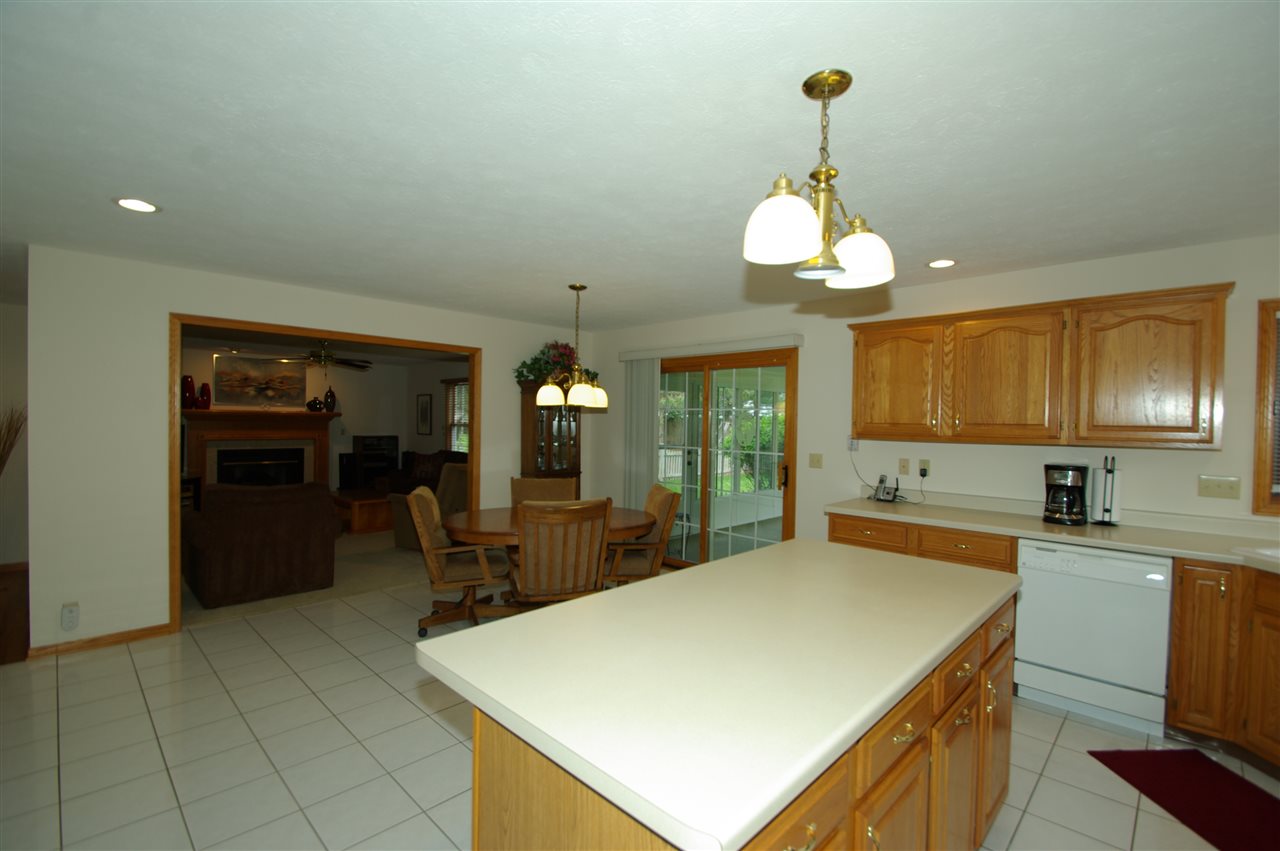 7254 Sentinel Road Rockford, IL 61107 - Photo 7 of 25 a kitchen with sink cabinets and dining table
