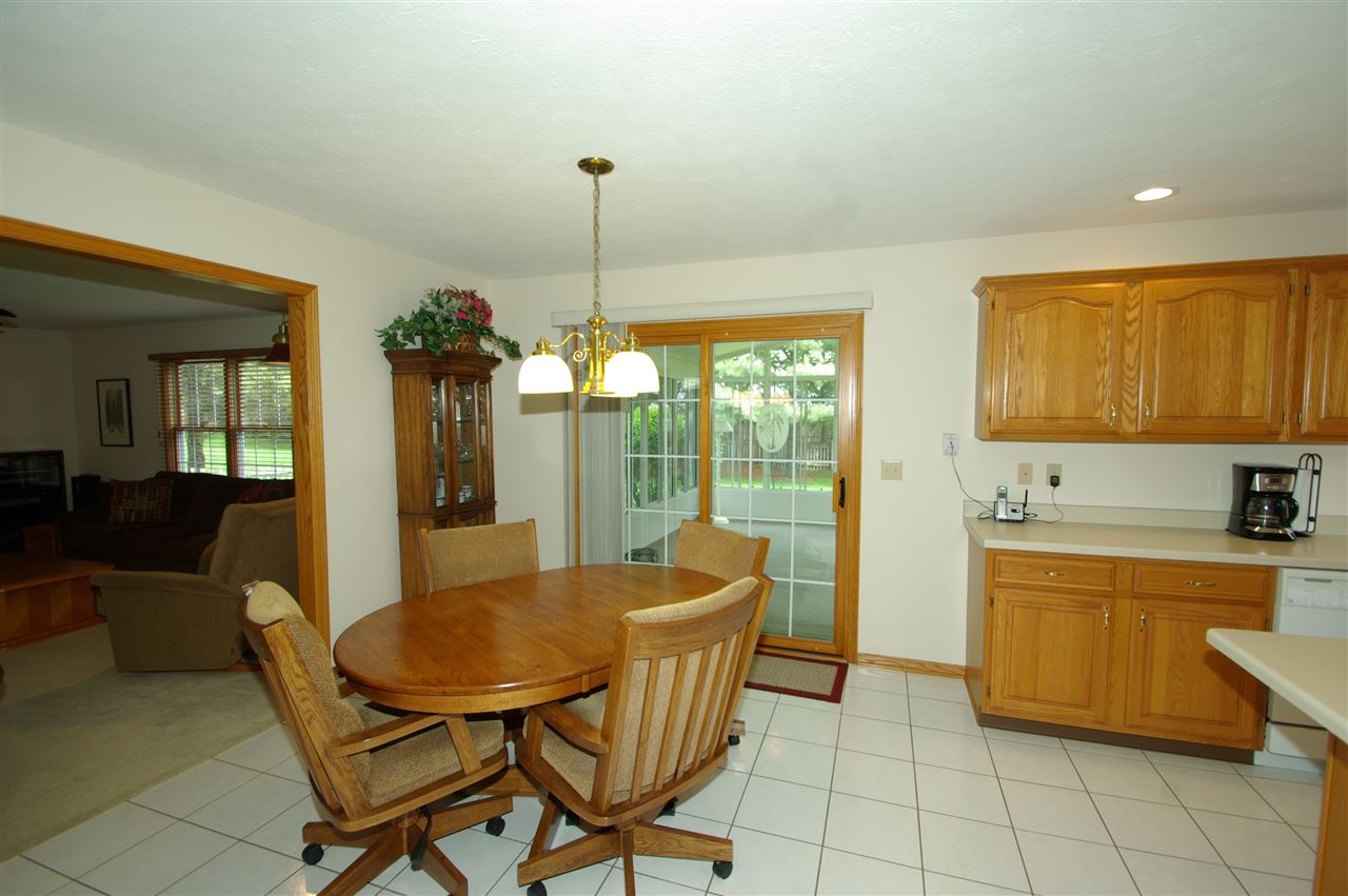 7254 Sentinel Road Rockford, IL 61107 - Photo 9 of 25 a dining room with furniture and a floor to ceiling window