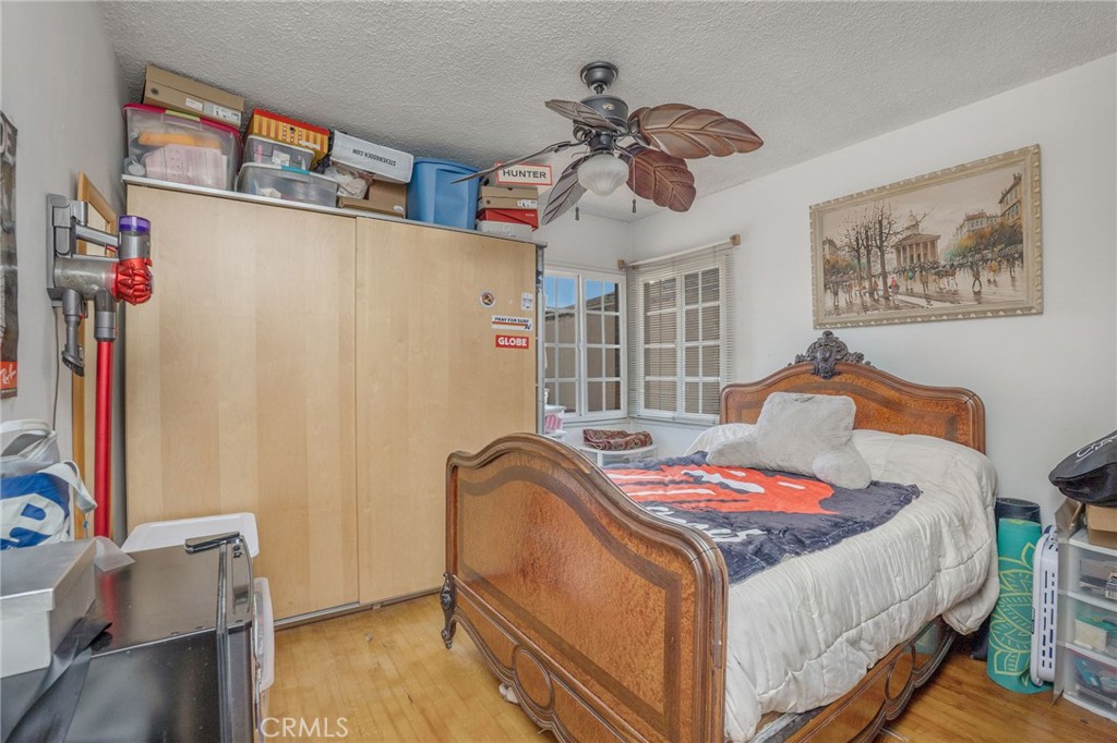 2905 Rindge Lane Redondo Beach, CA 90278 - Photo 11 of 26 a bedroom with a bed and wooden floor