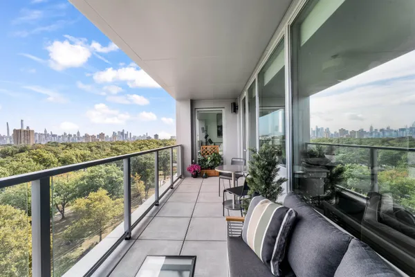 a view of balcony with furniture