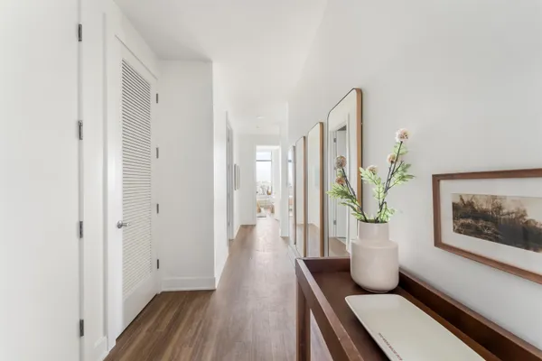 a view of an entryway and wooden floor