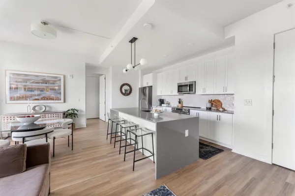 a view of kitchen with cabinets and wooden floor
