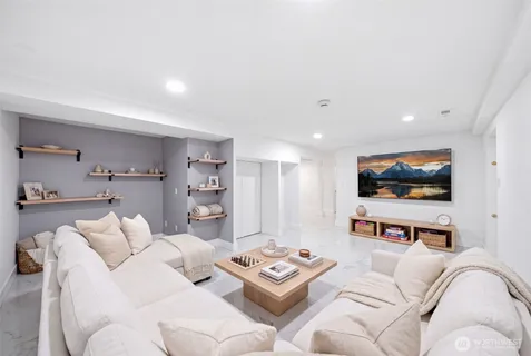 a bedroom with a bed and a couch