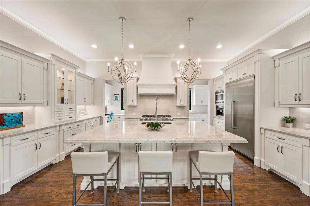809 Legacy Trail Colleyville, TX 76034 - Photo 13 of 40 a large kitchen with a table and chairs