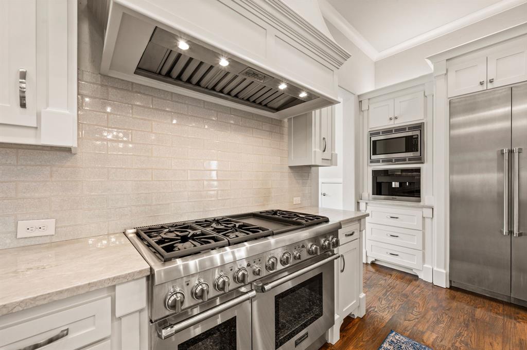 809 Legacy Trail Colleyville, TX 76034 - Photo 16 of 40 a kitchen with stainless steel appliances granite countertop a stove a refrigerator and a stove