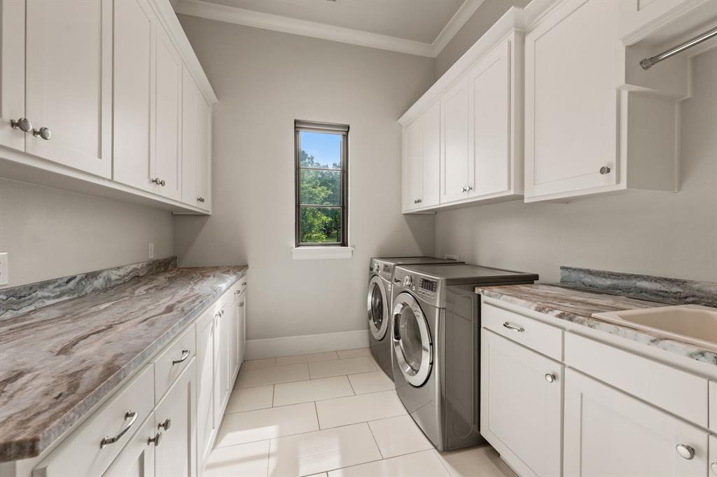 809 Legacy Trail Colleyville, TX 76034 - Photo 18 of 40 a kitchen with a stove top oven sink and cabinets