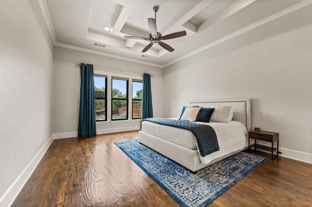 809 Legacy Trail Colleyville, TX 76034 - Photo 19 of 40 a bedroom with a large bed and a window