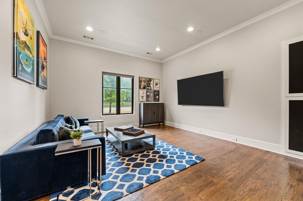 809 Legacy Trail Colleyville, TX 76034 - Photo 22 of 40 a living room with furniture a flat screen tv and a window