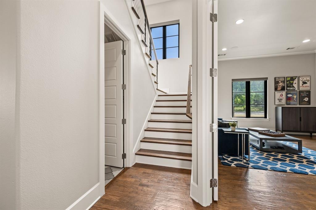 809 Legacy Trail Colleyville, TX 76034 - Photo 23 of 40 a view of a hallway with wooden floor and staircase