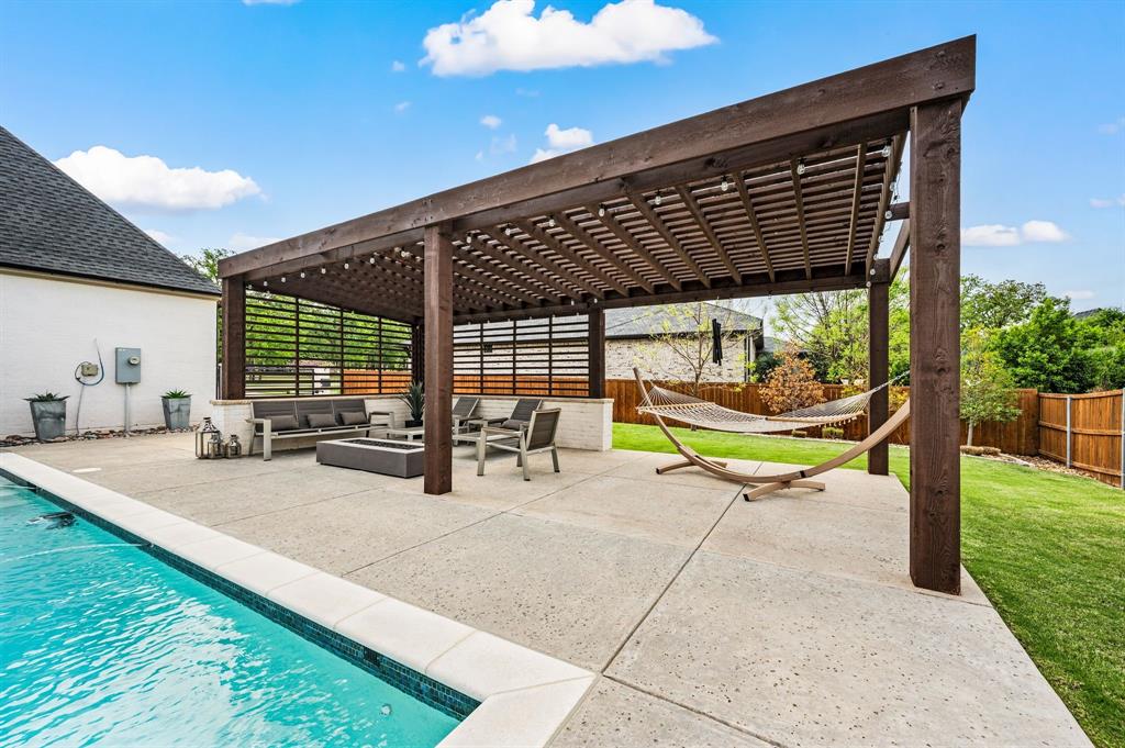 809 Legacy Trail Colleyville, TX 76034 - Photo 27 of 40 a view of a swimming pool with a patio