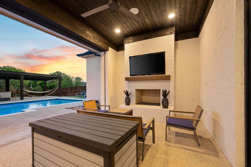 809 Legacy Trail Colleyville, TX 76034 - Photo 36 of 40 a outdoor space with furniture and a fireplace