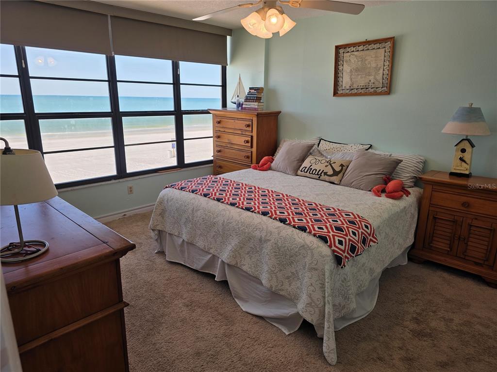 17580 Gulf Boulevard, Unit 311 Redington Shores, FL 33708 - Photo 16 of 34 a bedroom with a bed and a window