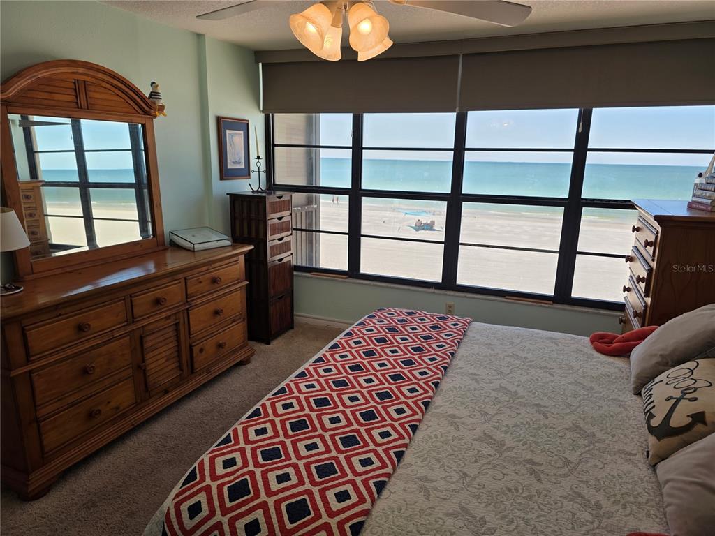 17580 Gulf Boulevard, Unit 311 Redington Shores, FL 33708 - Photo 17 of 34 a bedroom with a bed and a window