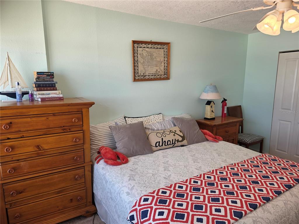 17580 Gulf Boulevard, Unit 311 Redington Shores, FL 33708 - Photo 18 of 34 a bedroom with a bed and closet