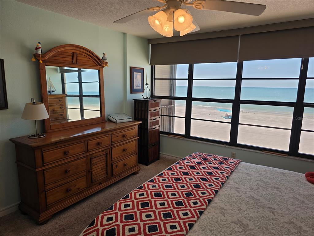 17580 Gulf Boulevard, Unit 311 Redington Shores, FL 33708 - Photo 19 of 34 a bedroom with a bed and a window in it
